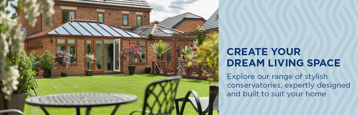 Victorian style golden oak conservatory with glass roof and French doors, overlooking a beautiful garden in Leicestershire.