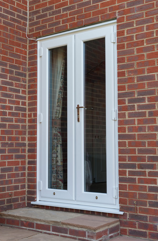 White uPVC French doors with double glazing, offering energy efficiency, security, and a stylish finish.