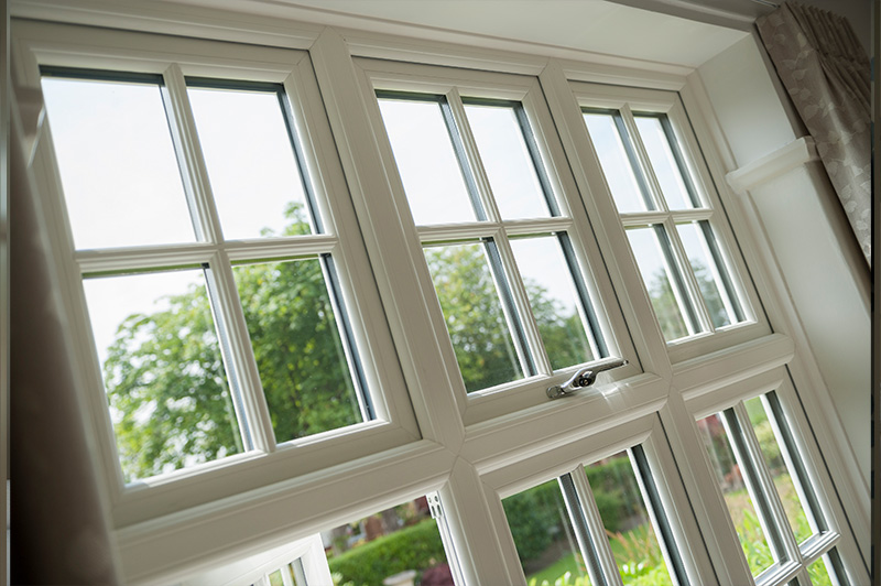 Bright room with white uPVC windows featuring Georgian bars.