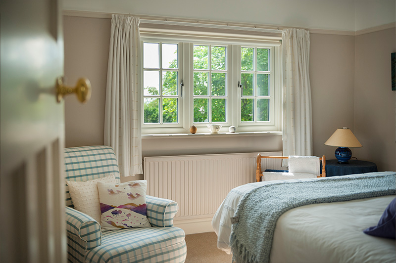 Traditional interior with white uPVC windows featuring Georgian bars.