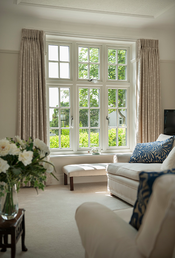 Light and airy interior with white uPVC windows featuring Georgian bars.